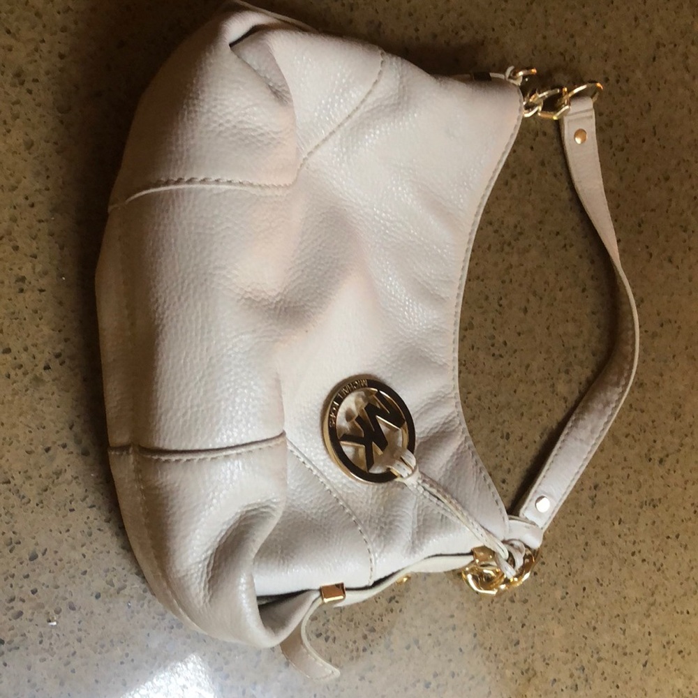 Michael Kors cream colored handbag